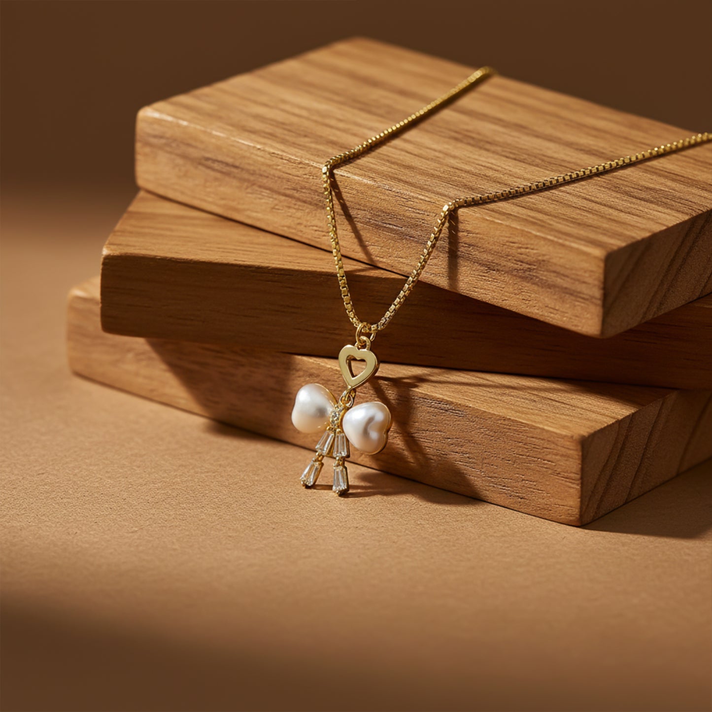 Elegant Gold Heart & Pearl Bow Necklace