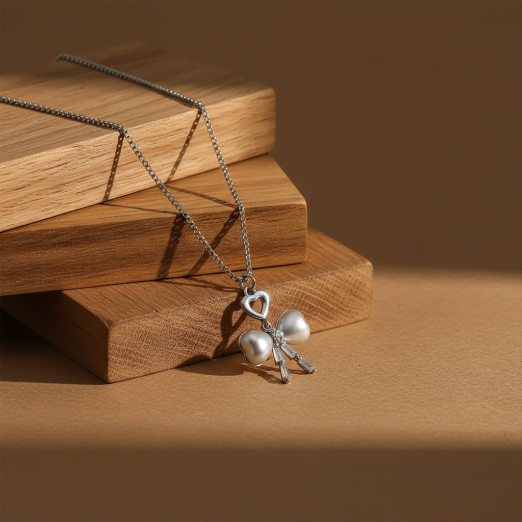 Elegant Silver Heart & Pearl Bow Necklace