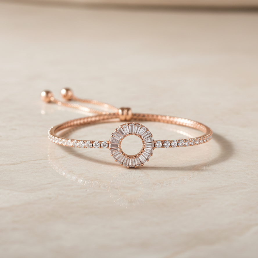 Rose gold bracelet with diamond accents on a light beige surface